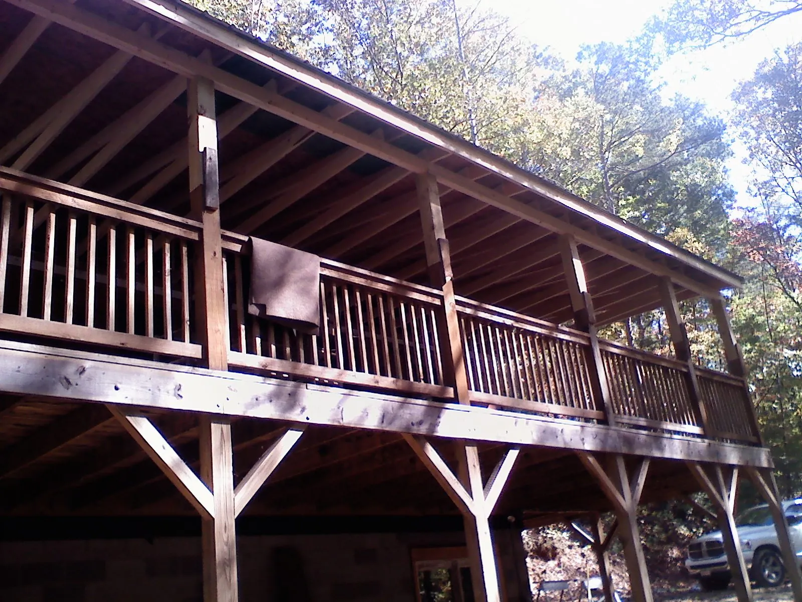 Timber framing under a new elevated porch and deck — Roof Leak Repair in Canton by Roofing Brothers